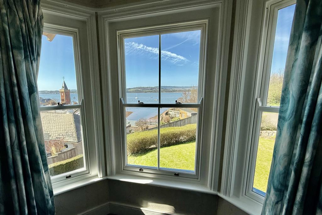 Lot: 153 - SEMI-DETACHED PROPERTY WITH SPECTACULAR WATERSIDE VIEWS, FOR REPAIR AND REFURBISHMENT - View through the window of bedroom one